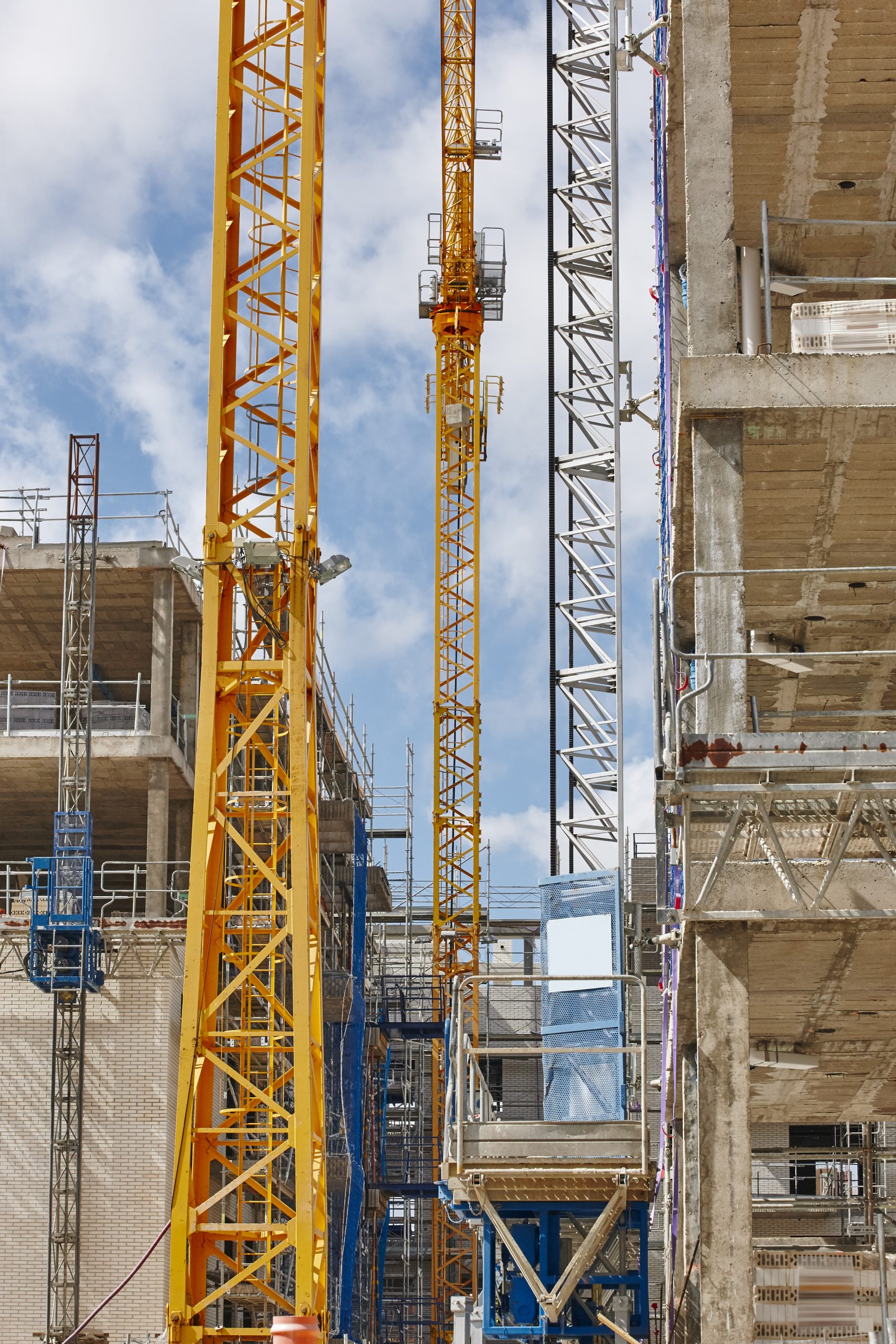 Building under construction. Crane machinery structure. Industry